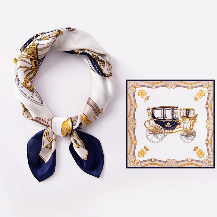 AuraOrient 100% Mulberry silk square scarf shown tied and laid flat, featuring an ornate golden pumpkin carriage motif and a sophisticated navy blue border.