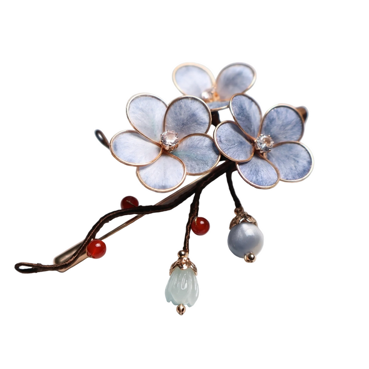 Close-up detail of the light blue plum blossom floral pin featuring charming dangling beads, perfect for securing a silk scarf.