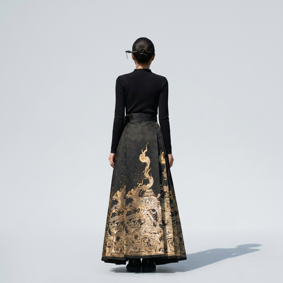 Back view of the regal black and gold dragon embroidered pleated skirt, showing the consistent heritage design and flow.