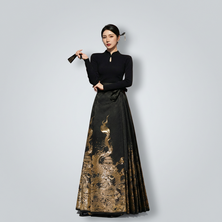Model posing with a black fan, wearing the regal dragon embroidered Hanfu-style skirt set for an elevated Chinoiserie look.