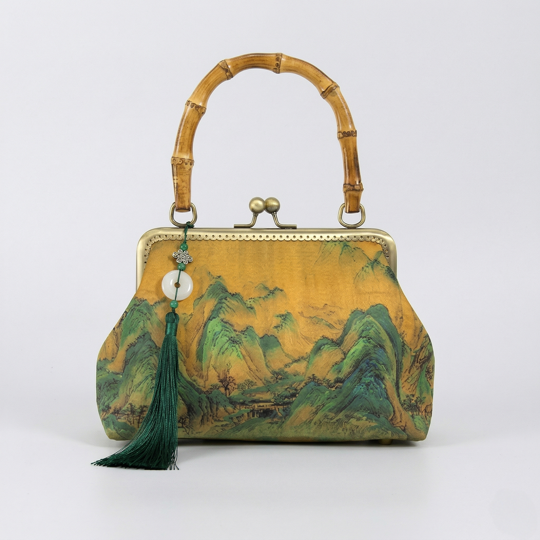 Front view of the Chinoiserie chic purse with a traditional bamboo top handle and detailed traditional Chinese mountain art.