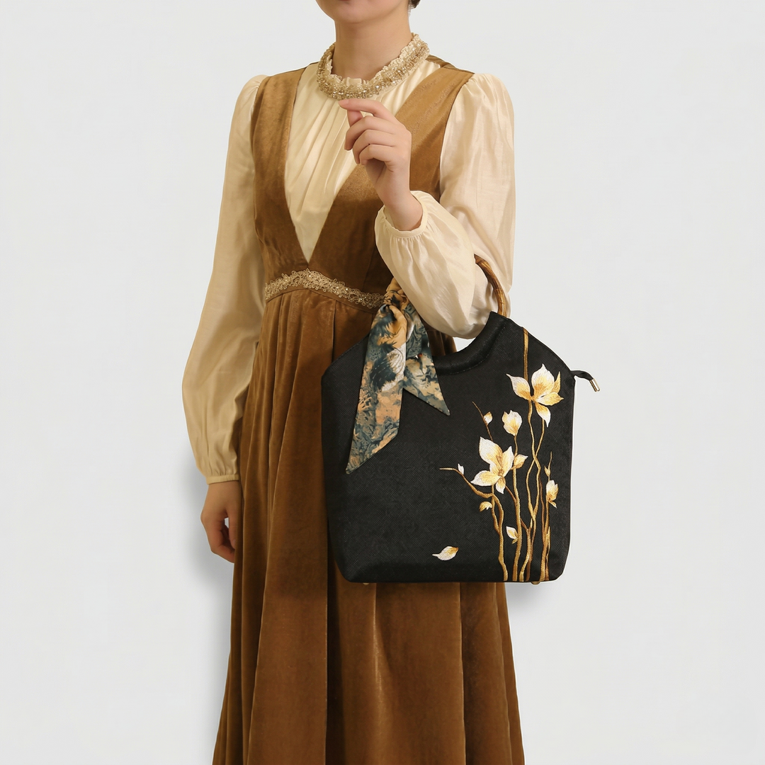 Model styling the Chinoiserie tote bag, highlighting the bag&