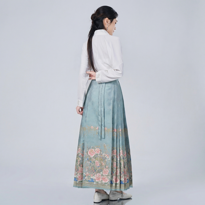 Side profile of the Chinoiserie wrap top and pleated skirt ensemble, demonstrating the graceful drape and flattering vintage-inspired silhouette.
