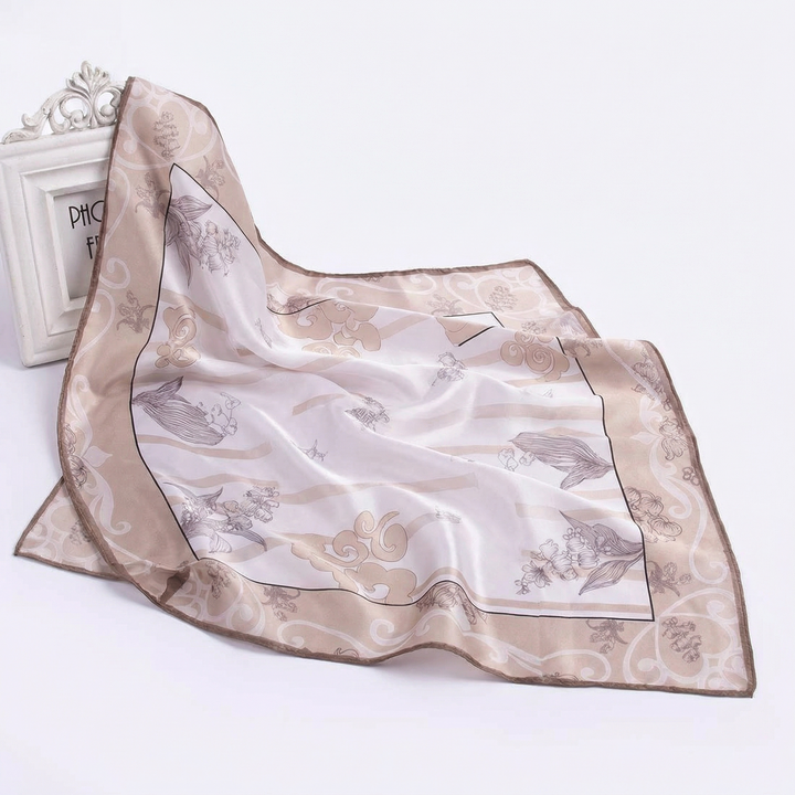 Draped view of a pure silk khaki neckerchief featuring understated minimalist luxury with delicate botanical line art and soft, breathable texture.
