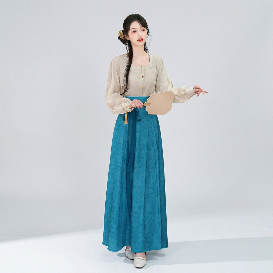 AuraOrient elegant teal blue floral paneled maxi skirt with a high-waisted A-line silhouette, paired with a beige vintage blouse.