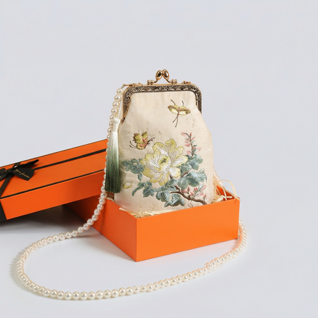 Luxurious orange gift box set for the embroidered kiss-lock mini bag, perfect for premium gift giving.