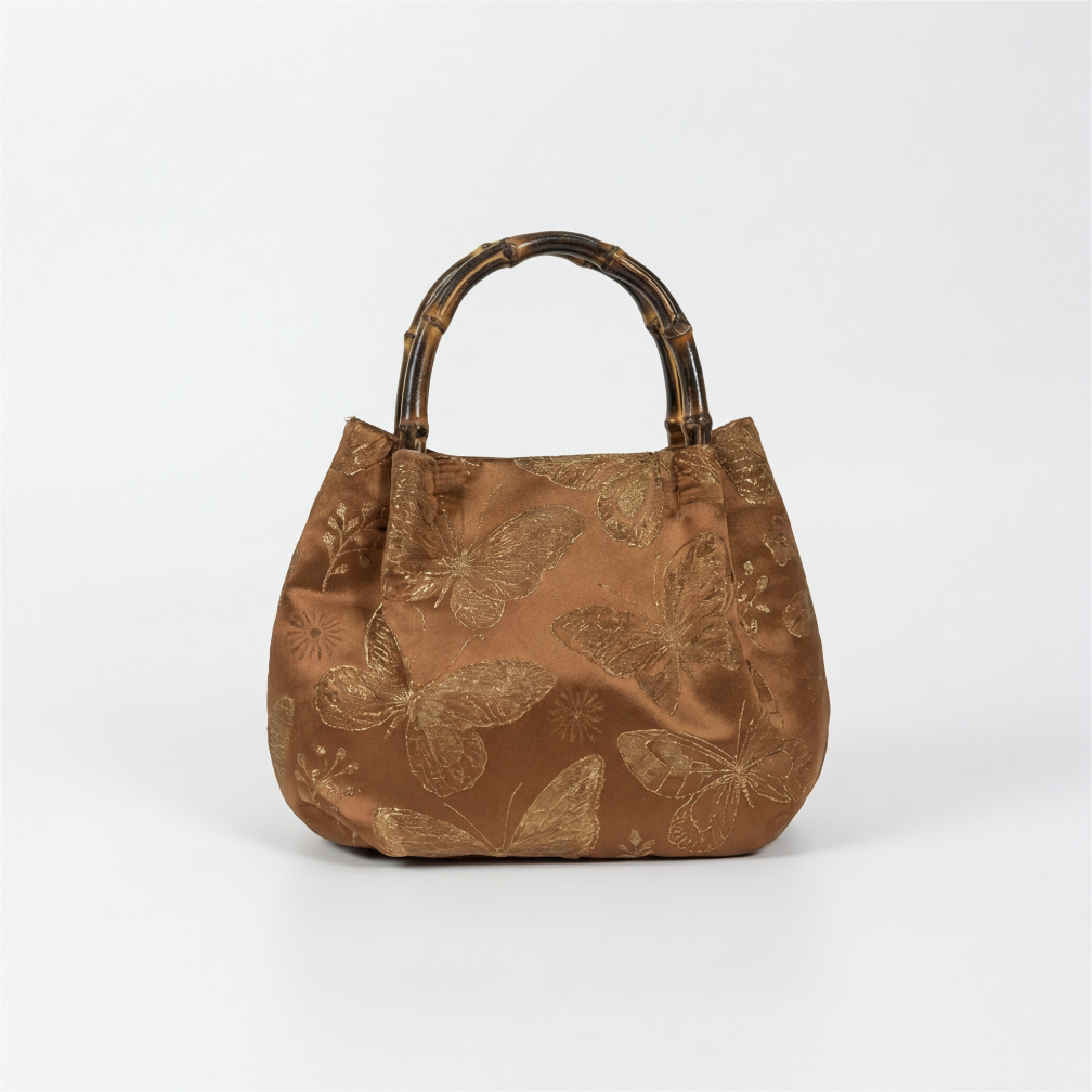 Front view of the handcrafted bronze Oriental satchel with premium silk-like brocade fabric.