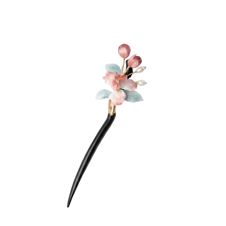 AuraOrient handcrafted pink iris hair stick made with delicate silk velvet petals and elegant pearl-like beads on a curved dark wooden pin.