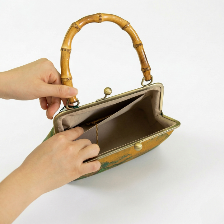 Interior view of the open kiss-lock handbag showing the spacious compartment and high-quality lining for personal essentials.