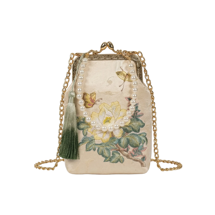 AuraOrient elegant off-white mini crossbody bag with delicate floral embroidery, a green tassel, and a vintage kiss-lock closure.