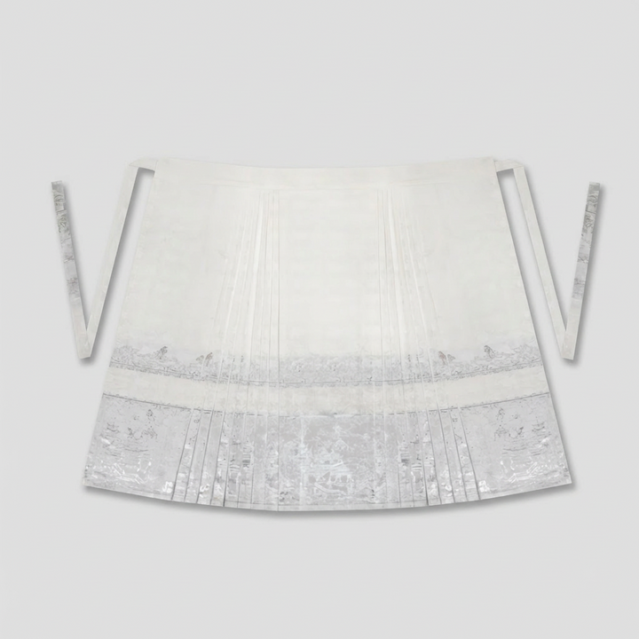 Flat lay of the silver jacquard Mamianqun (Horse-face skirt), showcasing the intricate traditional landscape weaving.