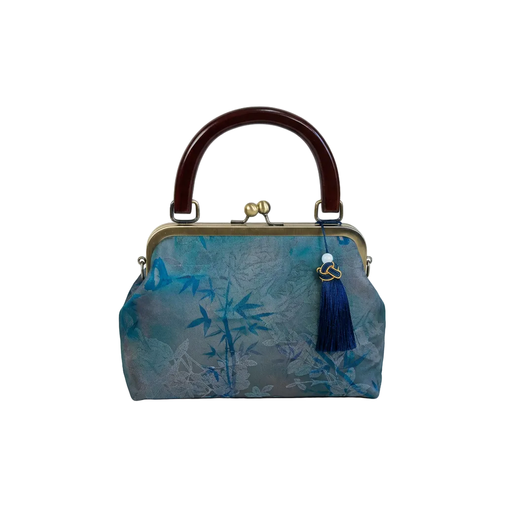 AuraOrient vintage artisan silk kiss-lock handbag in teal with an elegant bamboo print and dark blue tassel charm.