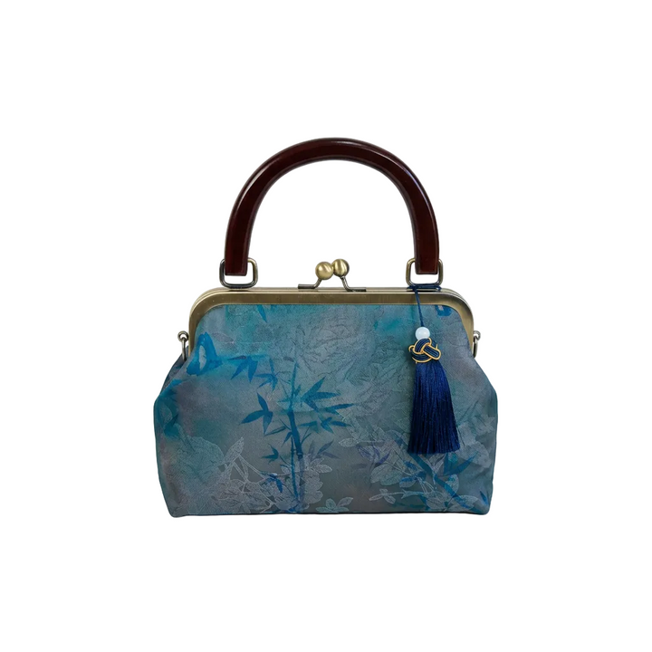 AuraOrient vintage artisan silk kiss-lock handbag in teal with an elegant bamboo print and dark blue tassel charm.