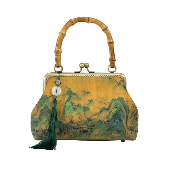 AuraOrient vintage-inspired kiss-lock handbag featuring a majestic Oriental landscape painting, authentic bamboo handle, and emerald green tassel.