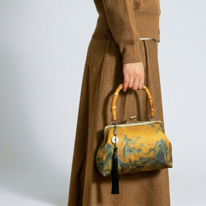 Vintage-style landscape handbag paired with a brown autumnal outfit, demonstrating its versatility for different fashion styles.